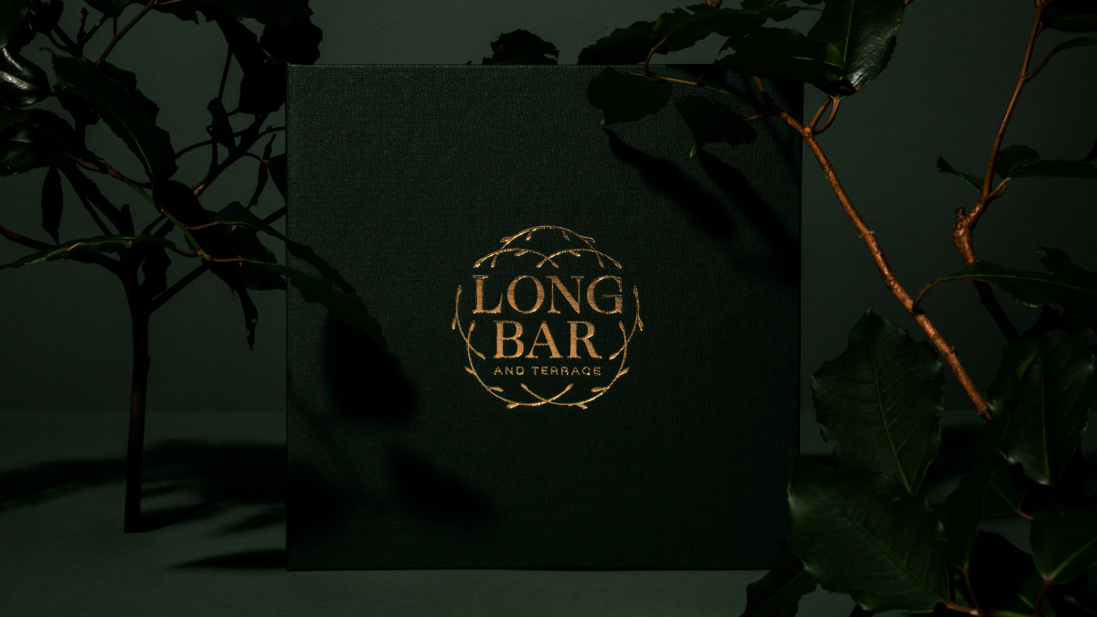 Long Bar linen-bound menu cover with gold foil.