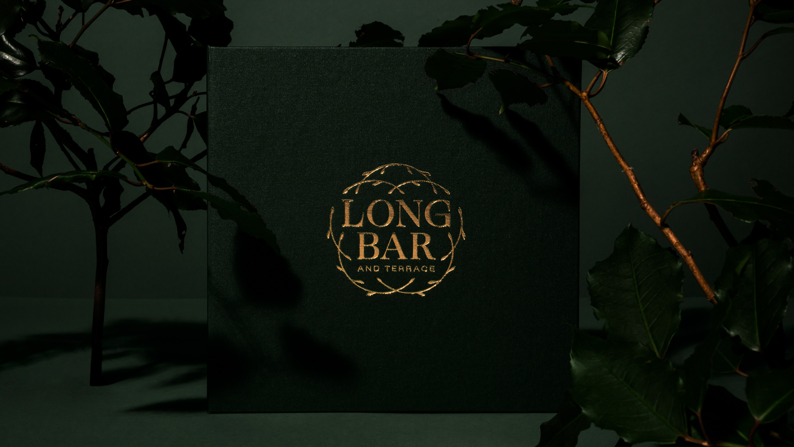 Long Bar linen-bound menu cover with gold foil.