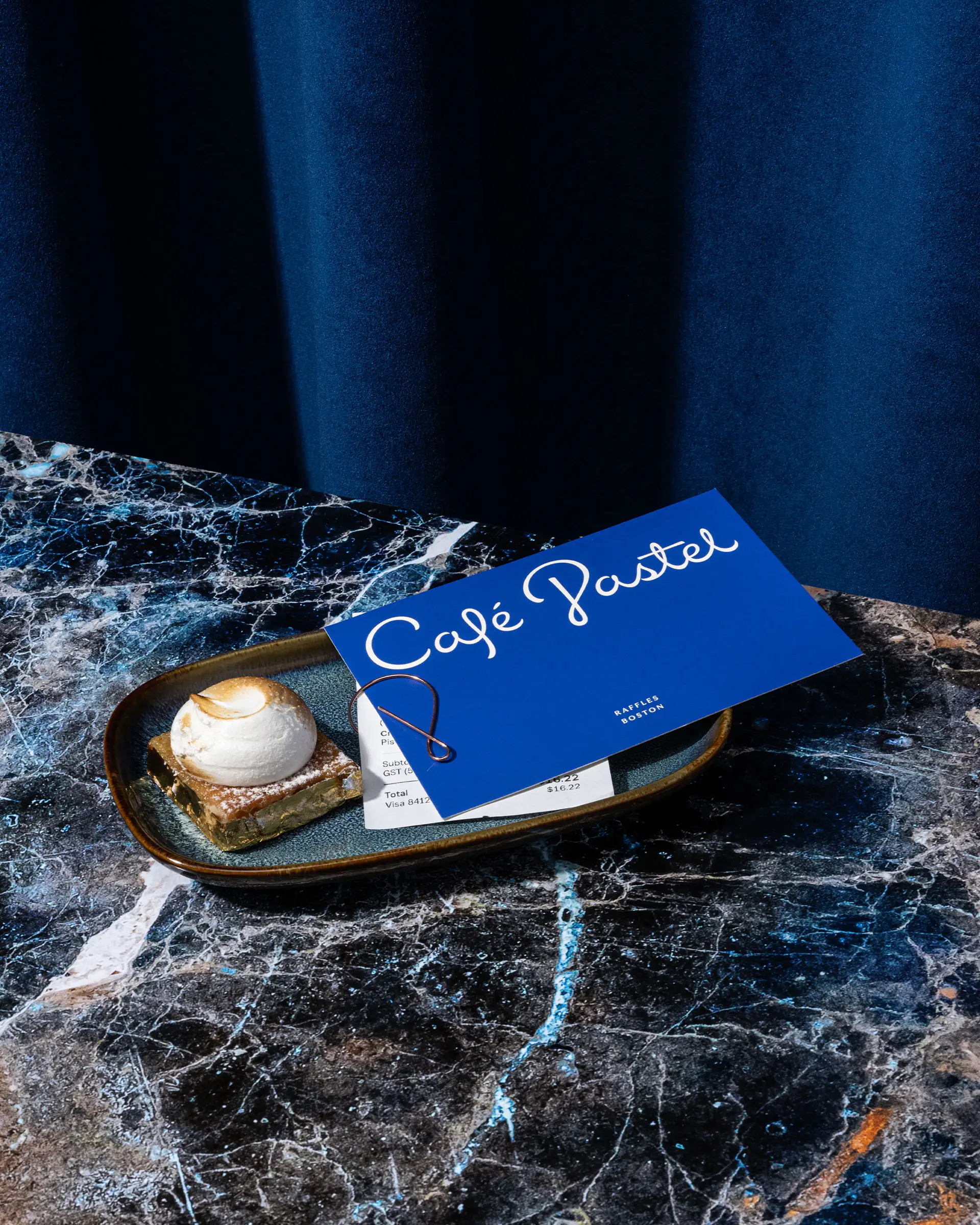 Cafe Pastel brand card and paper clip.