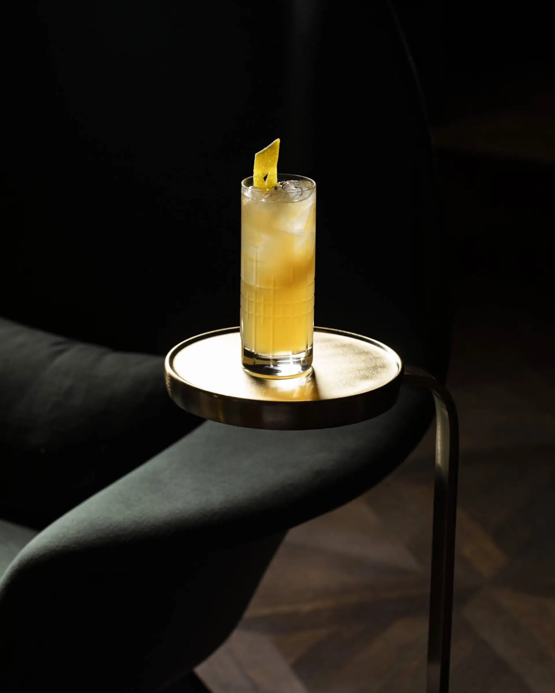 Cocktail with lemon rind.