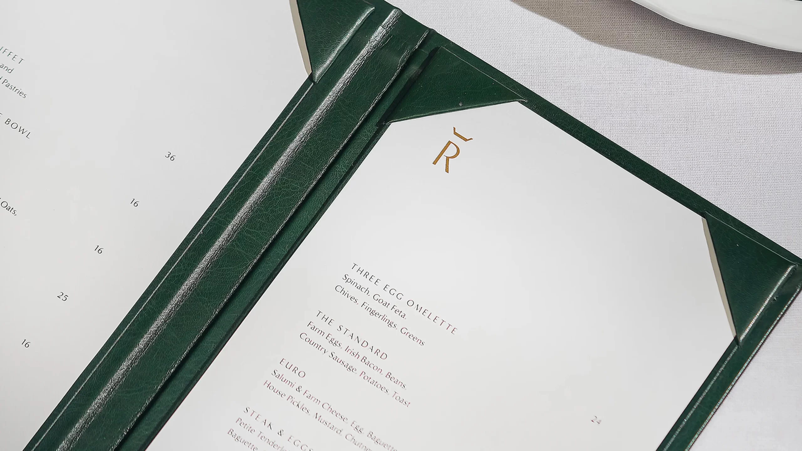 Reign menu interior with foil detail.