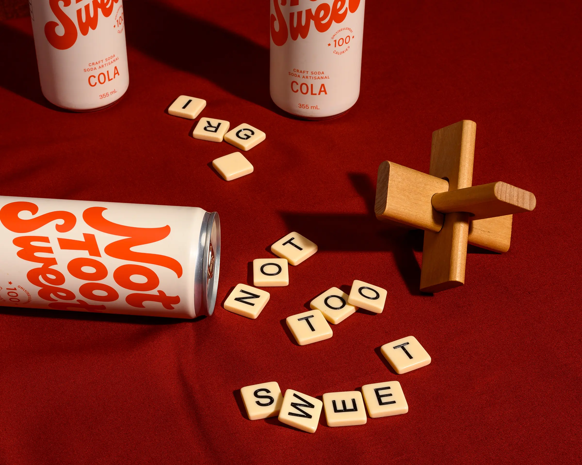 Can and scrabble tiles spelling out "Not Too Sweet".