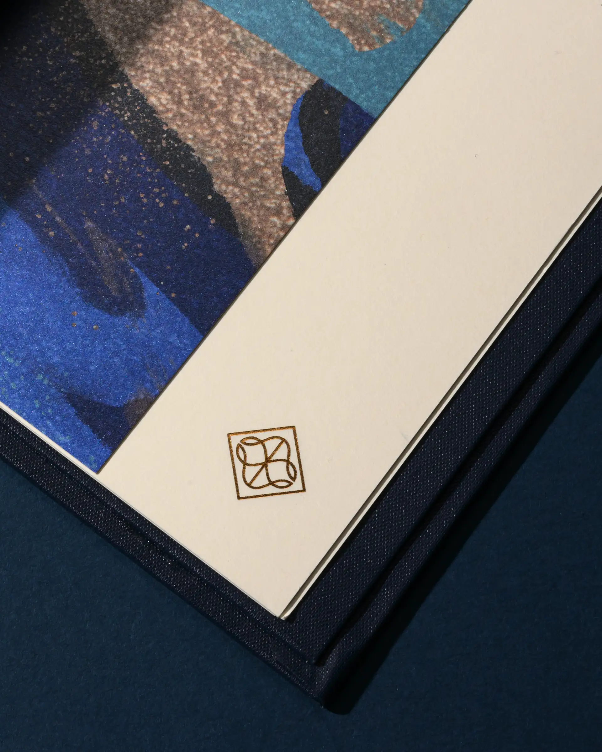 Amar menu interior with gold foil detail.