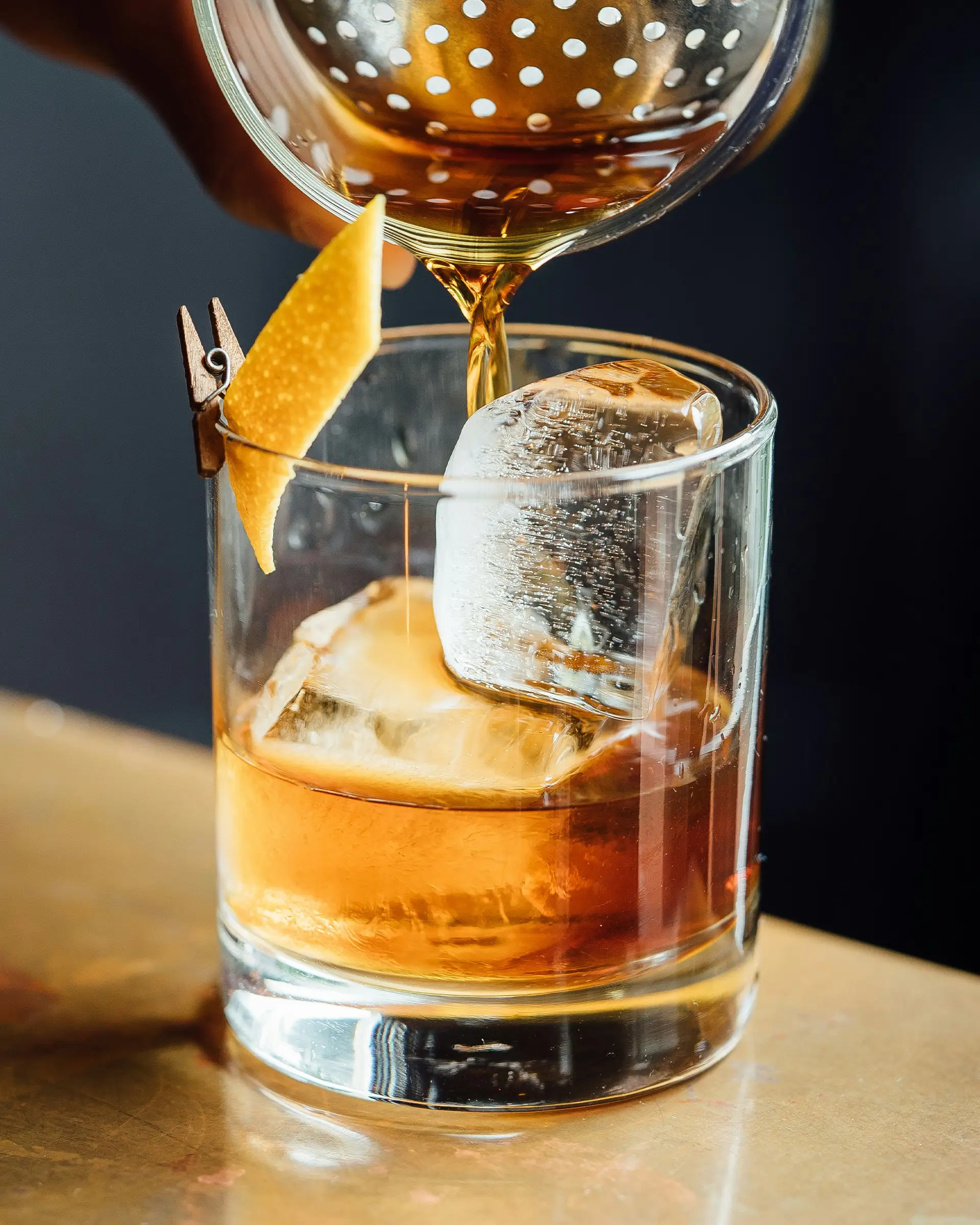 Glass of whiskey on the rocks.