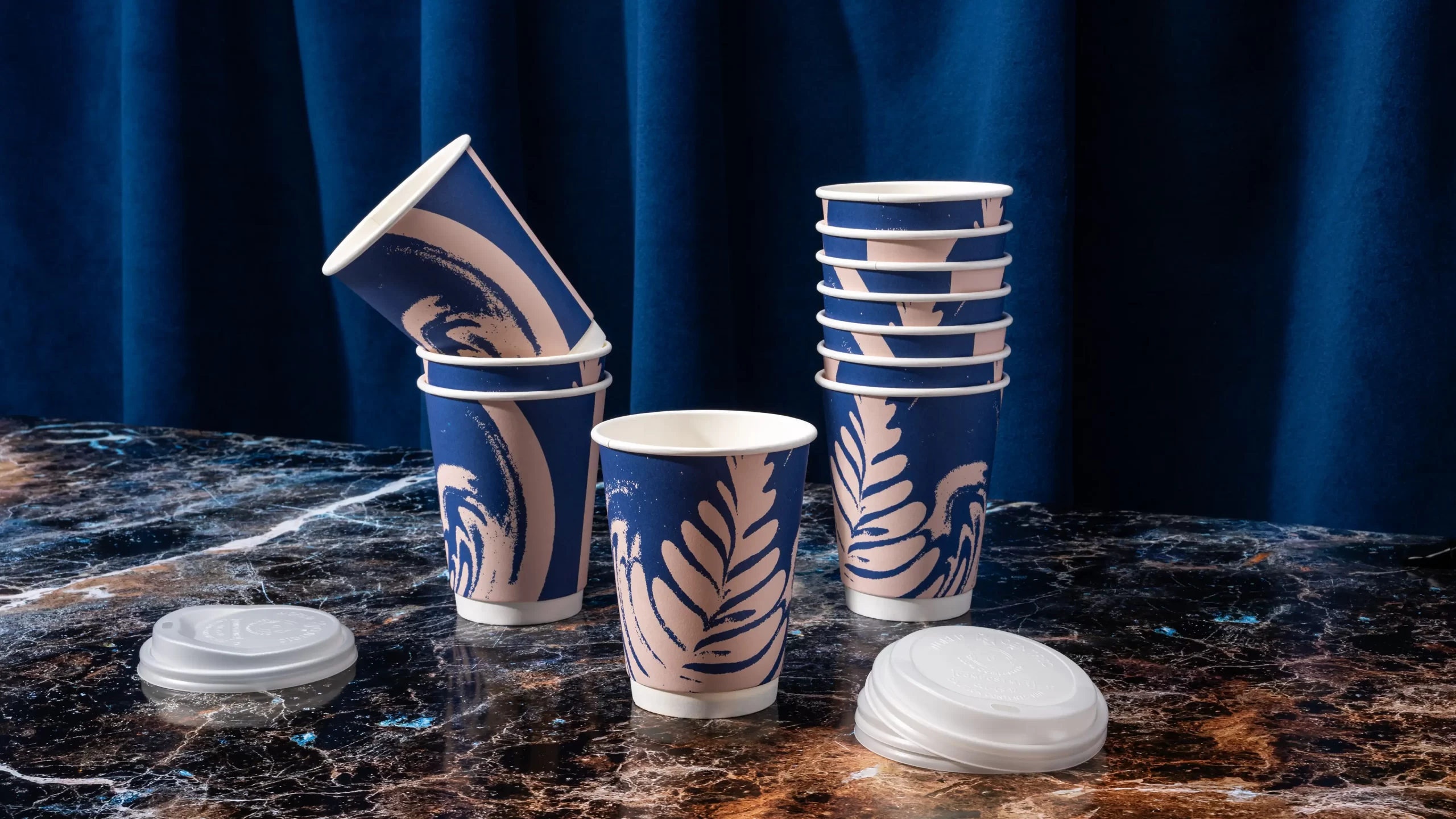 Cafe Pastel coffee cups stacked together.