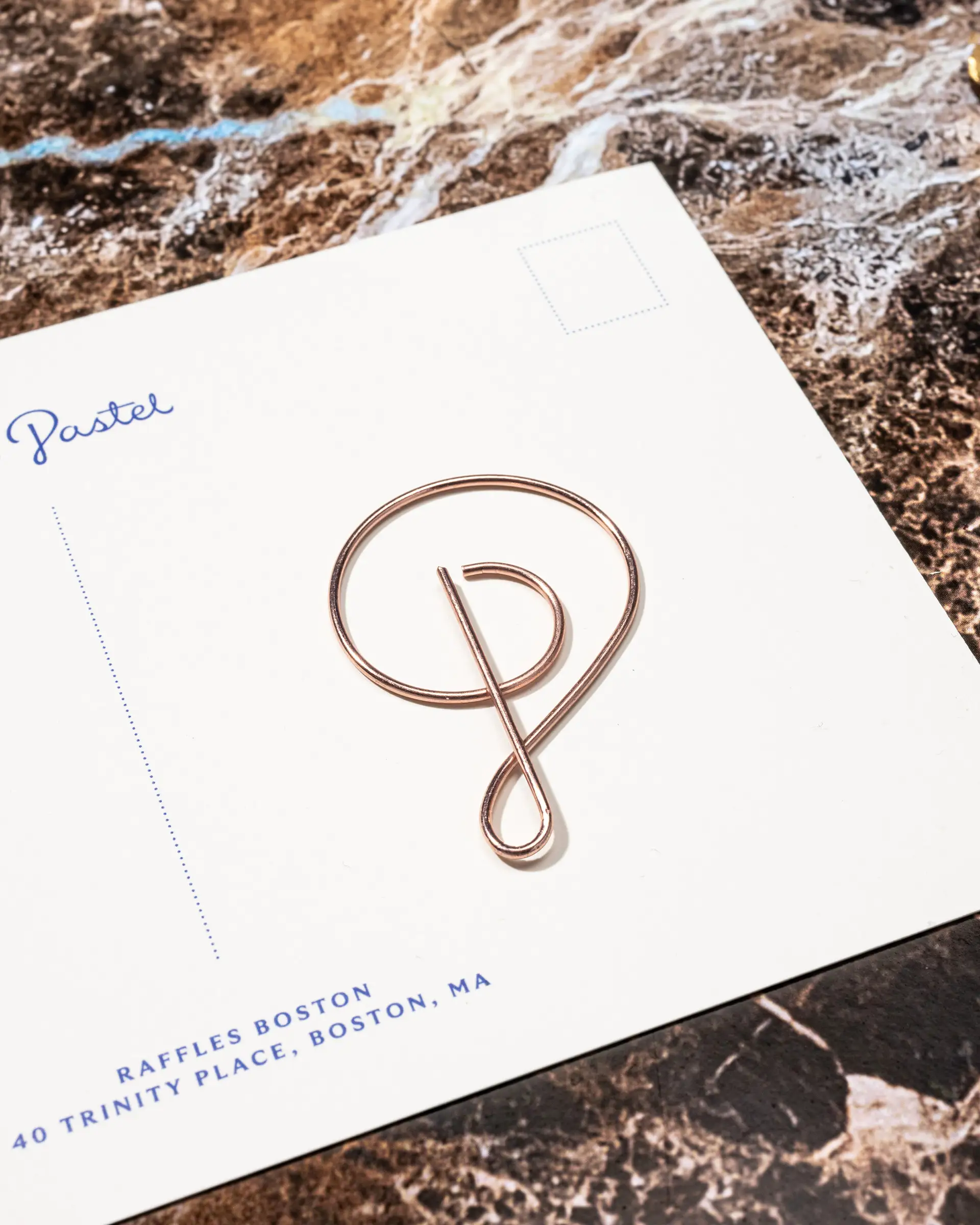 Cafe Pastel brand card and custom paper clip.